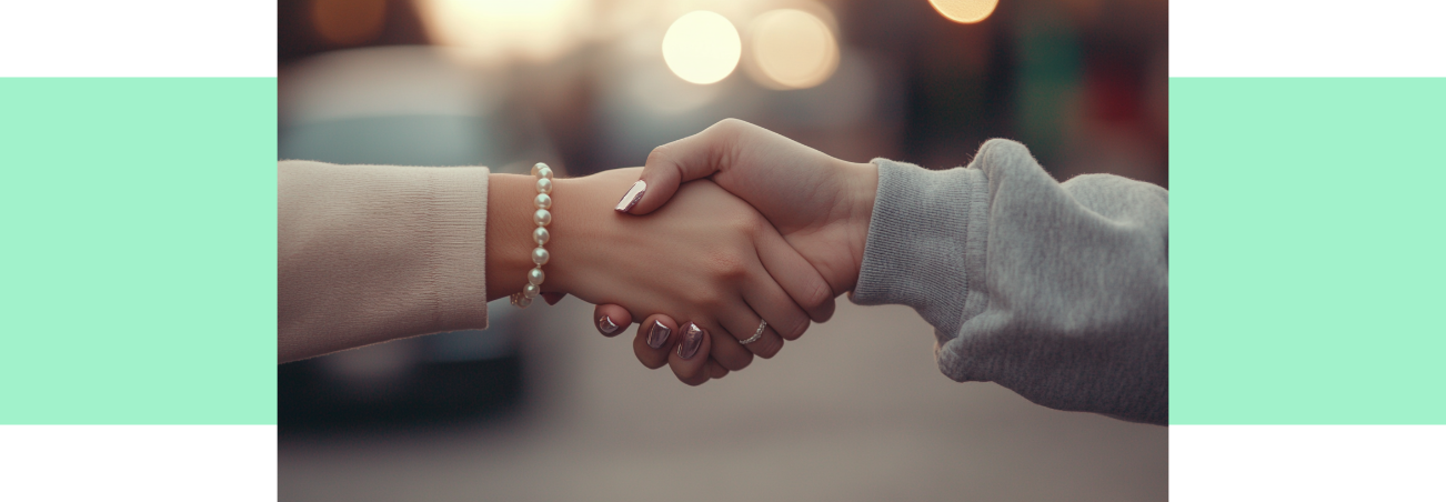 Two people shaking hands, the result of good customer service with intention shown towards professional or casual tone.